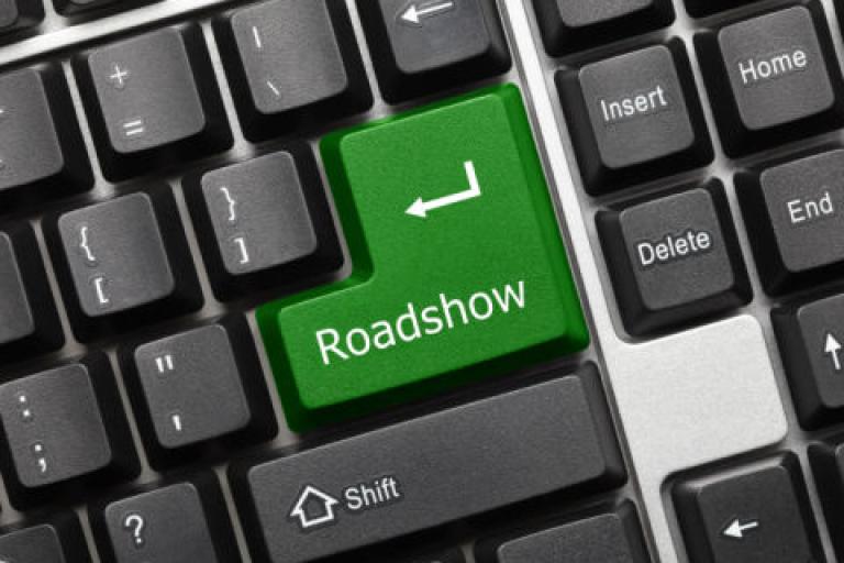 Image of a computer keyboard with Roadshow written on 