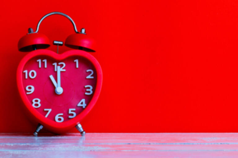 image of a red heart shaped clock