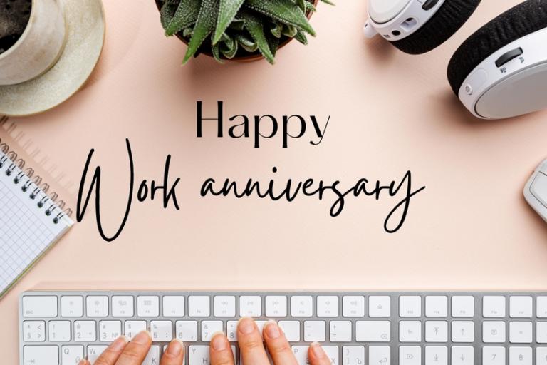 Work anniversary concept with keyboard and desk