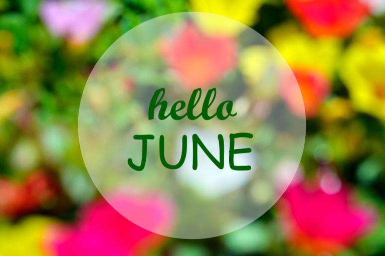 Words hello June in a circle, surrounded by a blurred out picture of colourful flowers