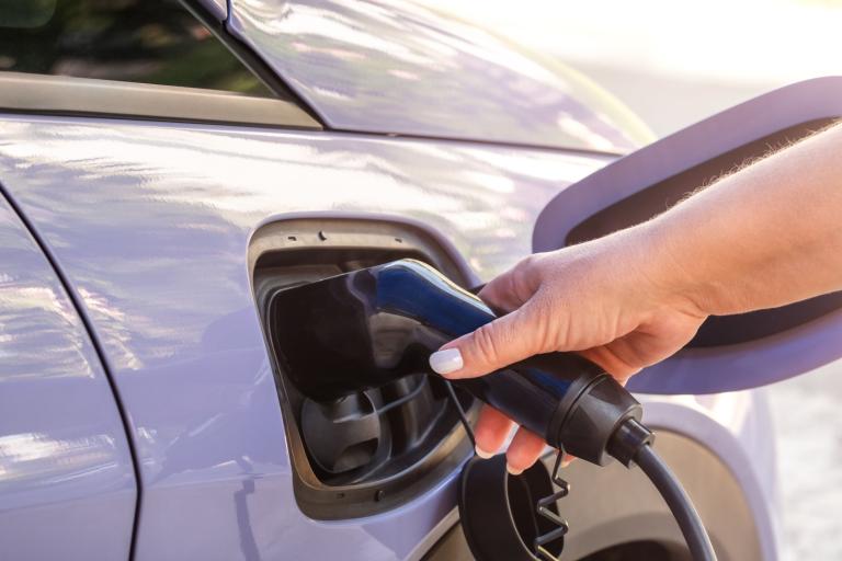 Car being charged by EV charger 