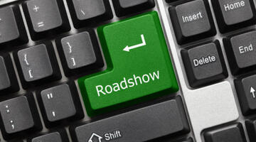 Image of a computer keyboard with Roadshow written on 