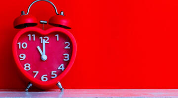 image of a red heart shaped clock