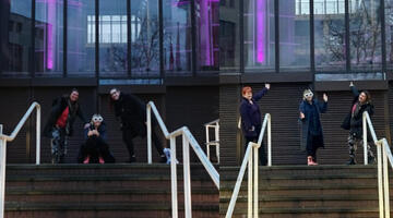 Four of our employee network leads outside County Hall which is lit up in the colour purple for International Day of People with Disabilities