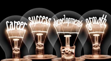 Four lightbulbs with the words career, growth