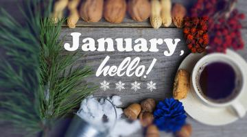 Words hello January, next to a couple of black coffee and some nuts and berries