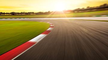 Driving racing track with sunlight in background