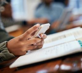 person's hand with a smartphone