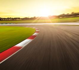 Driving racing track with sunlight in background