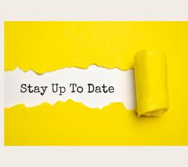 Yellow paper unpeeling to reveal the words stay up to date