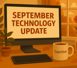 A realistic autumn-themed version of a workspace. A wooden desk with a computer monitor displaying technology update